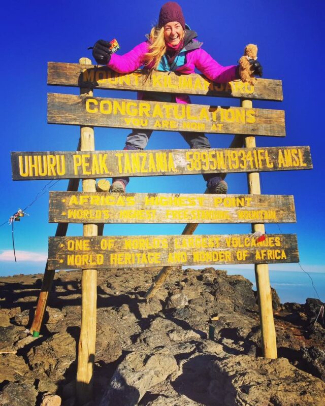 Happy Hiker Summits Kilimanjaro